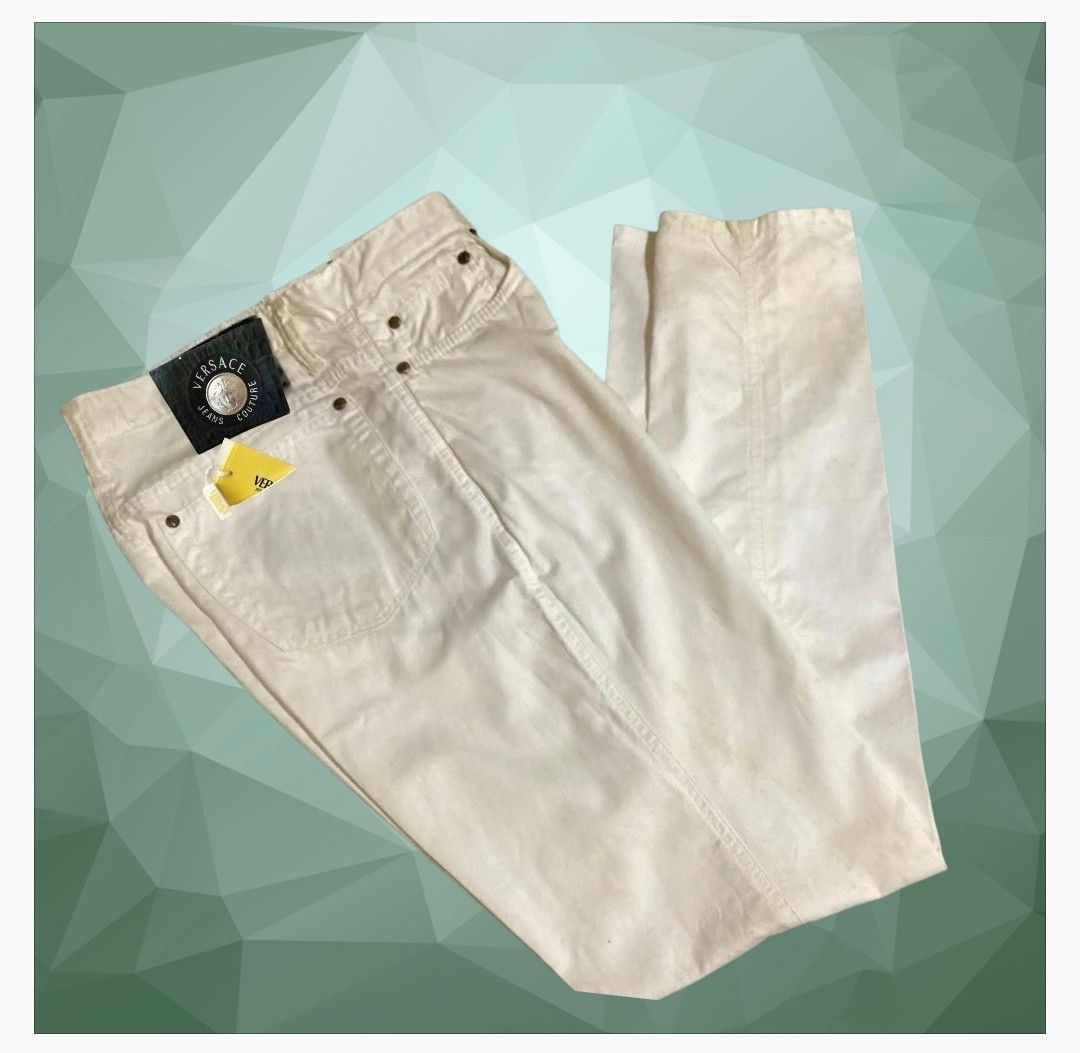 Versace Jeans Couture White Pants (Category: Jeans) located in Paranaque City. Submitted by calm_youngstore7 (Listing ID 1469872837, Image 2). Description: - Brand: Versace Jeans Couture - Color: Clean white - Style: High-waisted straight leg denim pants - Details: Signature Medusa logo hardware on buttons and rear leather patch - Pockets: Functional front and back pockets - Condition: Brand new with original store tags still attached in the back