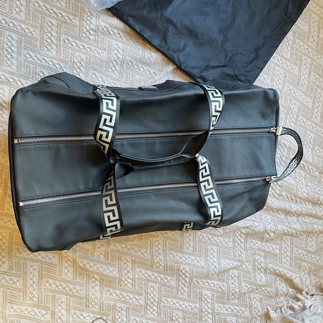 Versace Parfums Weekend Duffle Bag, Black Greca Print Straps, With Dust Bag (Category: Luxury Bags & Wallets) located in Quezon City. Submitted by francovvv (Listing ID 1469786321, Image 3). Description: - 12in (height) 20.5in (width).