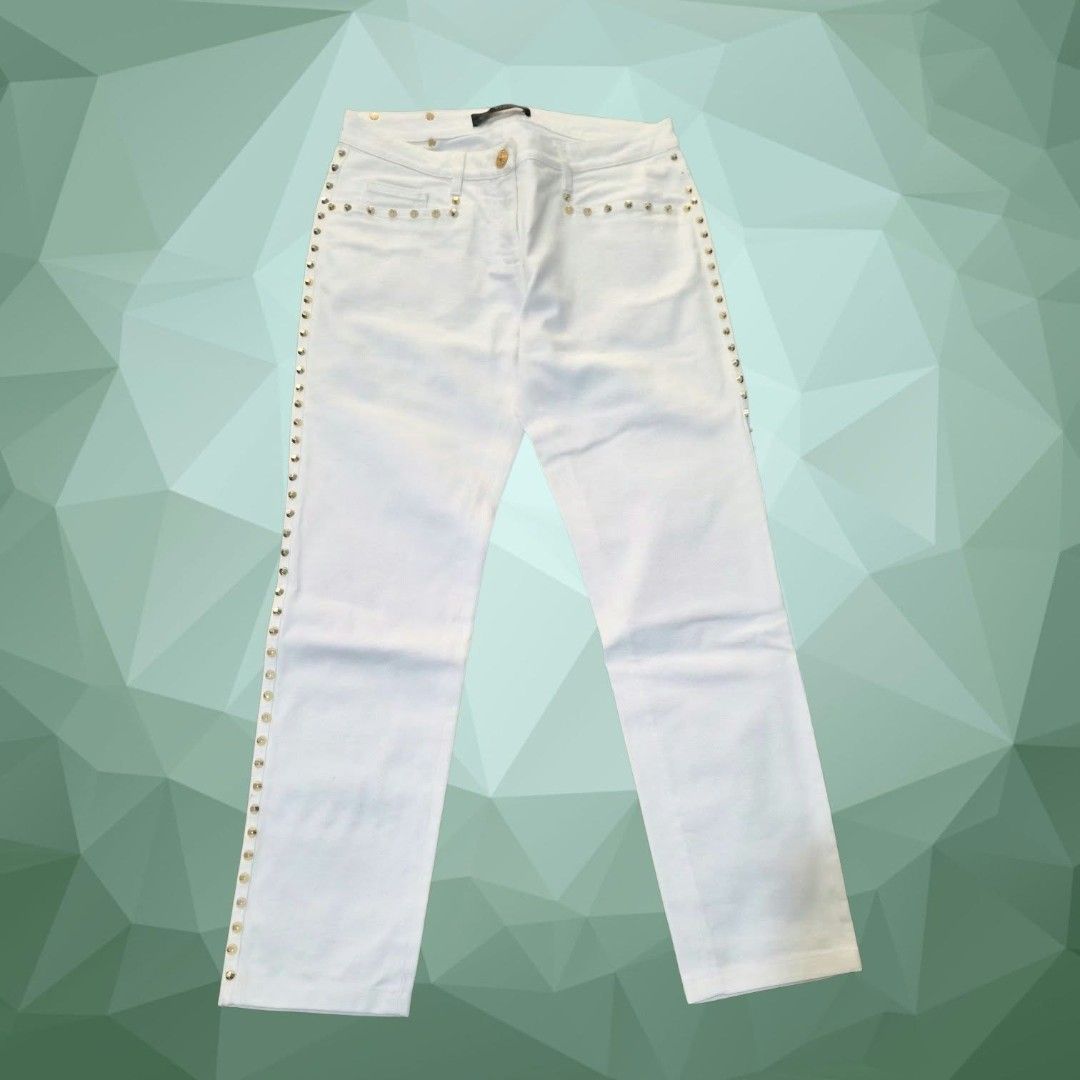 Versace White Studded Denim Jeans (Category: Jeans) located in Paranaque City. Submitted by calm_youngstore7 (Listing ID 1469873305, Image 2). Description: ON SALE! VERSACE STUDDED JEANS 70% OFF RETAIL! LAST PIECE SALE! - Brand: Versace - Color: White denim - Hardware: Gold-tone studs on side seams and pockets - Details: Gold metal logo patch on back waistband - Closure: Branded button closure - Style: Classic five-pocket design - Condition: Exce