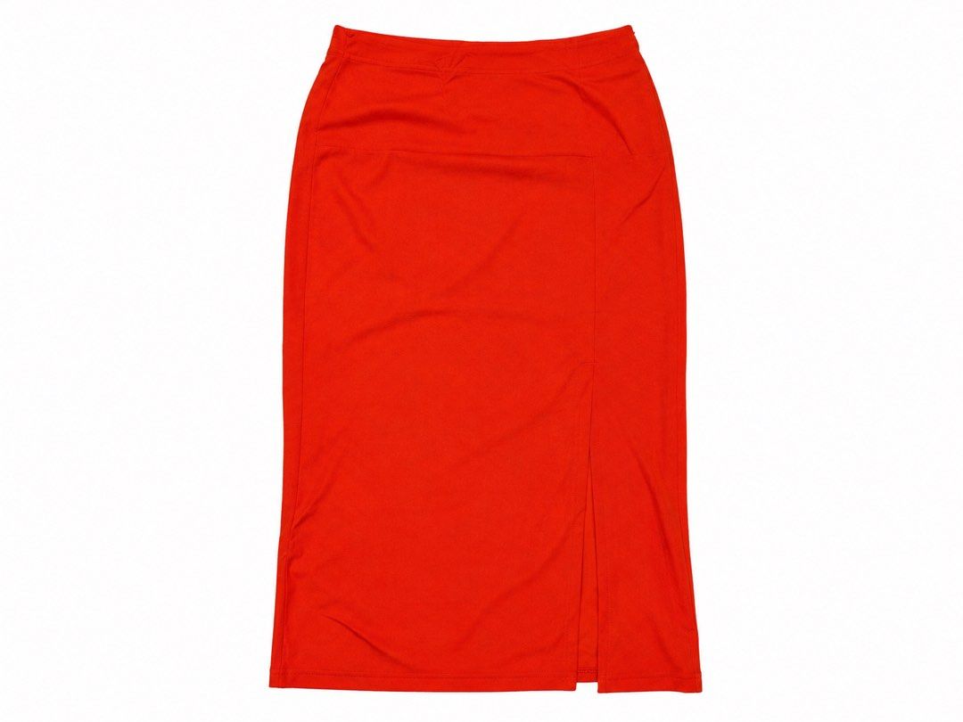Vibrant Red Orange Midi Skirt with Slit (Category: Skirts) located in Marikina City. Submitted by ziaziaaa (Listing ID 1469893389, Image 1). Description: - Color: Bright red - Length: Midi (hits around mid-calf) - Fit: Tailored with a clean waistband - Details: Subtle front slit on the right side - Fabric: Smooth and stretchy for comfort - Style: Versatile for casual or dressed-up looks - Condition: Excellent.