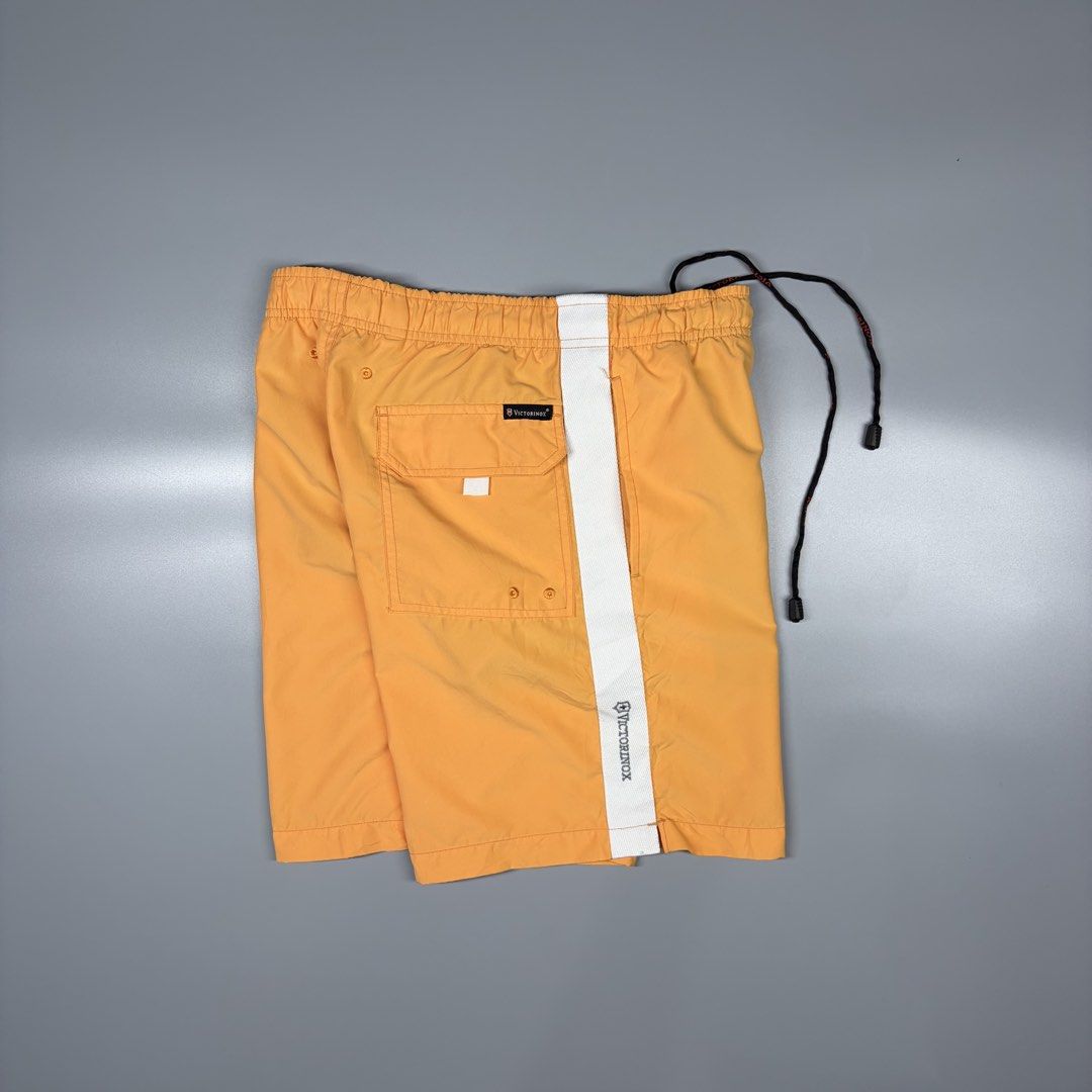 Victorinox Nylon Short With Inner Mesh (Category: Activewear) located in Cavite. Submitted by onebeancent (Listing ID 1469863652, Image 1). Description: Size: 30 to 34 Waistline Dimension: 17" Length Color: Orange Color Rate: 9.5/10 Issue: None Condition: Excellent Price: 680php Additional Shipping Fee (J&T Small Pouch) 75php Luzon 100php visayas 120php mindanao.
