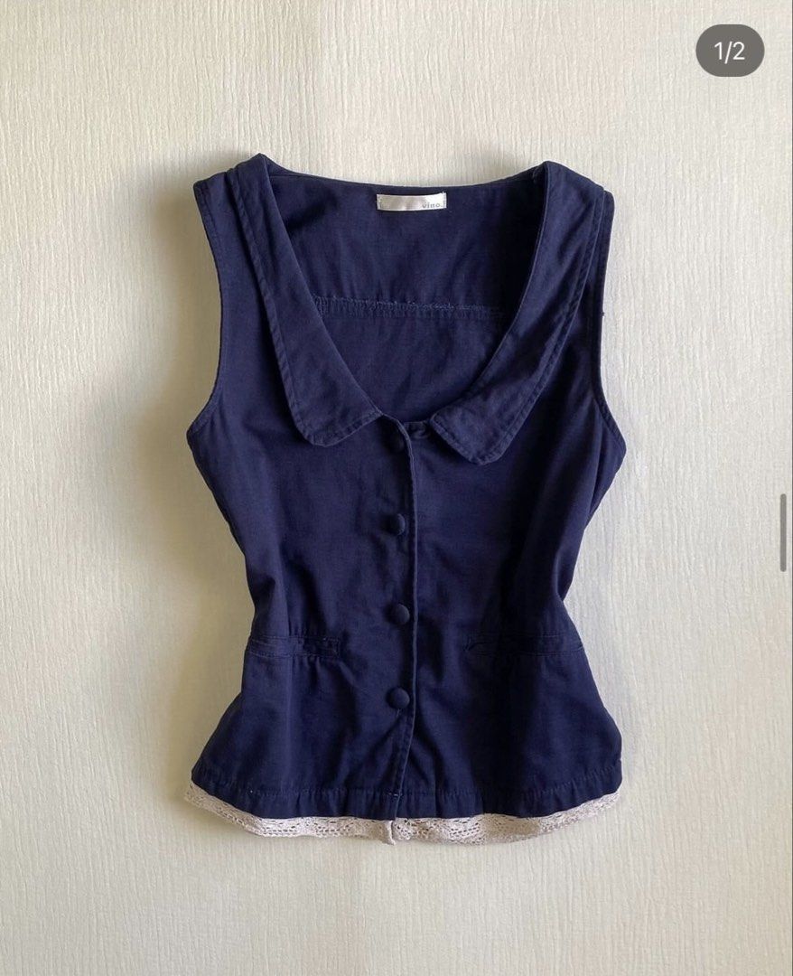 VINO Midnight Blue Peter Pan Collar Top Fits M (Category: Blouses) located in Pateros City. Submitted by overandout. (Listing ID 1469824057, Image 1). Description: - Brand: VINO - Color: Midnight blue - Style: Sleeveless top with Peter Pan collar and button-up front - Details: Front pockets, lace trim hem, and adjustable back tie sash - Size: Fits Small to Medium (Length: 21 inches, Bust: 34 inches, Waist: 34 inches) - Condition: Excellent - Boug