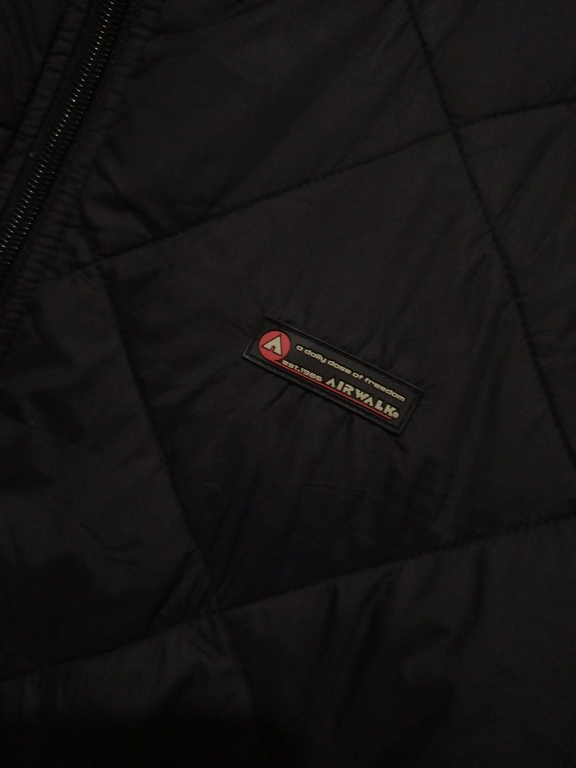 Vintage Airwalk Black Quilted Puffer Jacket (Category: Coats, Jackets and Outerwear) located in Rizal. Submitted by gmpastoffi75031 (Listing ID 1469806968, Image 2). Description: - Brand: Airwalk - dimes 23x27.5 - Size: Medium (M) - Color: Classic Black - Design: Stylish diamond quilted pattern with a small logo patch on the left chest - Closure & Collar: Full zip front with a cozy stand collar - Pockets: Two functional zippered lower front pocke