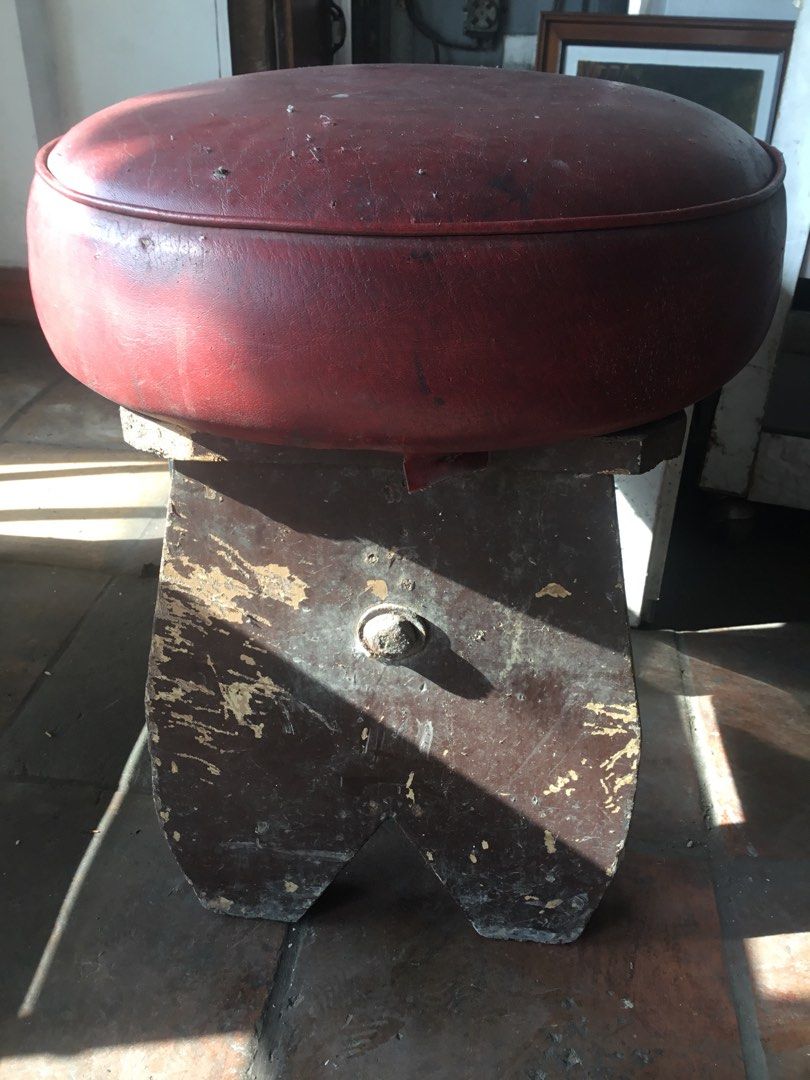 Vintage red leather top wooden stool (Category: Chairs) located in Manila. Submitted by roberto.enriquez (Listing ID 1469817550, Image 2). Description: - Vintage round stool featuring a dark red cushioned leather seat - Heavy, solid dark brown wooden base with sturdy construction - Charming distressed finish with natural scuffs and wear marks from age - Great DIY project piece for restoration - Perfect addition to rustic or vintage home decor.