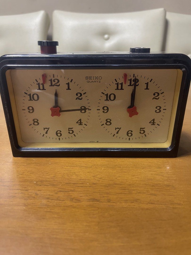 Vintage Seiko Quartz Chess Clock (Category: Clocks) located in Manila. Submitted by chesterson1979. (Listing ID 1469935658, Image 1). Description: - Authentic vintage Seiko quartz chess clock, made in Japan - Dual analog clock faces with charming red star-shaped hands - Classic top buttons for switching player turns smoothly - Battery-operated and fully functional for all your matches - Condition: Shows minor surface scuffs and scratches on the c