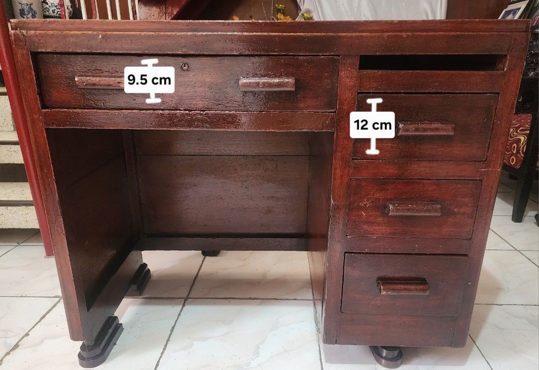 Vintage Solid Wood Desk (Red Narra / Mahogany) with Multiple Drawers (Category: Office Furniture & Fixtures) located in Manila. Submitted by grace_san48 (Listing ID 1469813928, Image 1). Description: - Type: Solid wooden desk with dark stain finish - Storage: 1 wide top drawer, 3 stacked right-side drawers - Dimensions: 91 cm (L) x 55.5 cm (W) x 77 cm (H) - Condition: Sturdy construction with traditional stepped feet; shows some surface scuffs an