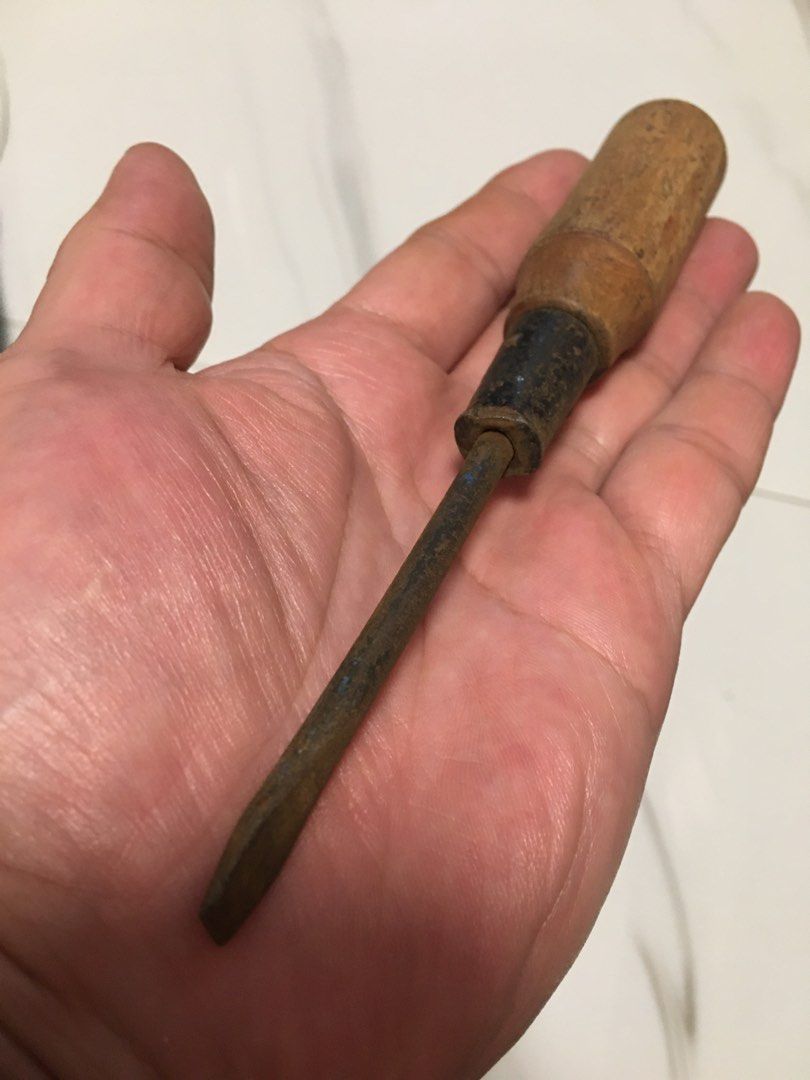 Vintage wooden handle flathead screwdriver antique tool (Category: Vintage Collectibles) located in Pasay City. Submitted by gilbertso62551 (Listing ID 1469827721, Image 2). Description: - Vintage flathead screwdriver with solid, heavy-duty construction - Sturdy wooden handle with natural weathering and age marks - Metal shank featuring authentic rust spots for a rustic look - Ideal for antique tool collectors, rustic displays, or restoration pro
