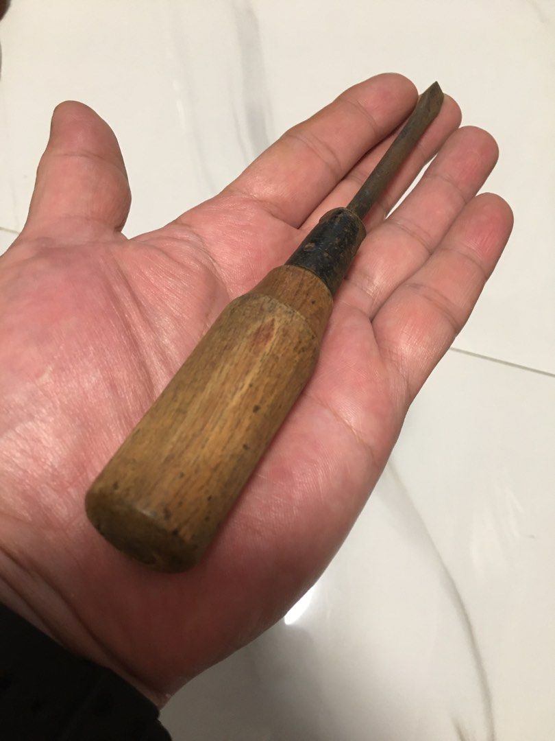 Vintage wooden handle flathead screwdriver antique tool (Category: Vintage Collectibles) located in Pasay City. Submitted by gilbertso62551 (Listing ID 1469827721, Image 3). Description: - Vintage flathead screwdriver with solid, heavy-duty construction - Sturdy wooden handle with natural weathering and age marks - Metal shank featuring authentic rust spots for a rustic look - Ideal for antique tool collectors, rustic displays, or restoration pro