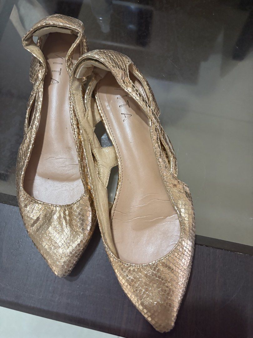 VITA Gold Pointed Toe Flats Size 37 (Category: Flats & Sandals) located in Bacoor. Submitted by grandfire.02c841 (Listing ID 1469880632, Image 1). Description: - Brand: VITA - Size: 37 - Color: Gold metallic with snakeskin texture finish - Design: Pointed toe flats with low block heel and cutout sides - Condition: Light wear on the soles and inner lining creases from previous use.