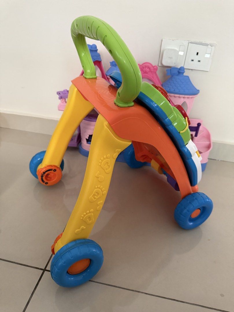 Vtech Push Walker (Category: Kids Toys) located in Melaka Tengah. Submitted by dekiddosark (Listing ID 1469915743, Image 3). Description: 🔆 Learning Walker Music Toys. Function well. Complete Semua. Phone pun ada. Ade 2 speed control untuk support baby walking stages. Awal2 guna no 1 dulu. Bile anak dah biasa guna 2. Lagi laju anak tolak lagi laju encouragement music tu main. 🔆 Ada 2 cara main ni. 1. Sit to play. Boleh cabut panel tu untuk baby