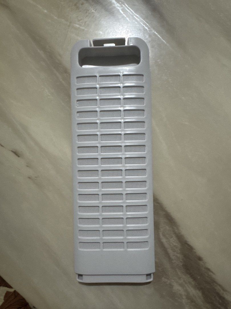W3DA Panasonic Washing Machine Filter 25x8.5cm (Category: Washing Machines and Dryers) located in Taguig. Submitted by bljm_declutter (Listing ID 1469890718, Image 2). Description: - Item: Plastic storage divider organizer (Large Model W3DA) - Condition: Brand new, unused (ordered wrong size) - Color: Grey - Dimensions: 25cm (L) x 8.5cm (W) .