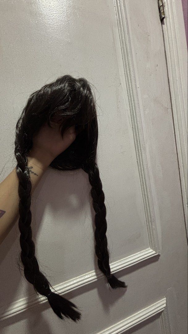 Wednesday Addams Style Black Braided Wig (Category: Hair Accessories) located in Binan City. Submitted by coat_inthemiddle (Listing ID 1469860239, Image 1). Description: Wednesday braided wig Used in Halloween costume as Wednesday.