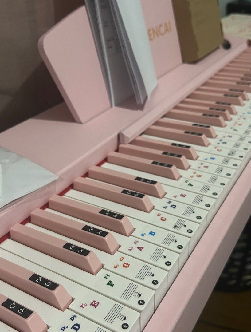 WENCAI Pink Electronic Keyboard Piano (Category: Musical Instruments) located in Manila. Submitted by donnaburde79462 (Listing ID 1469798454, Image 1). Description: - Aesthetic soft pastel pink WENCAI digital weighted keyboard - Full 88-key standard layout with alternating pink and white sharps/flats - Beginner-friendly: includes note and staff stickers applied on all keys for easy sheet music reading - Comes with a matching pink music rest stand