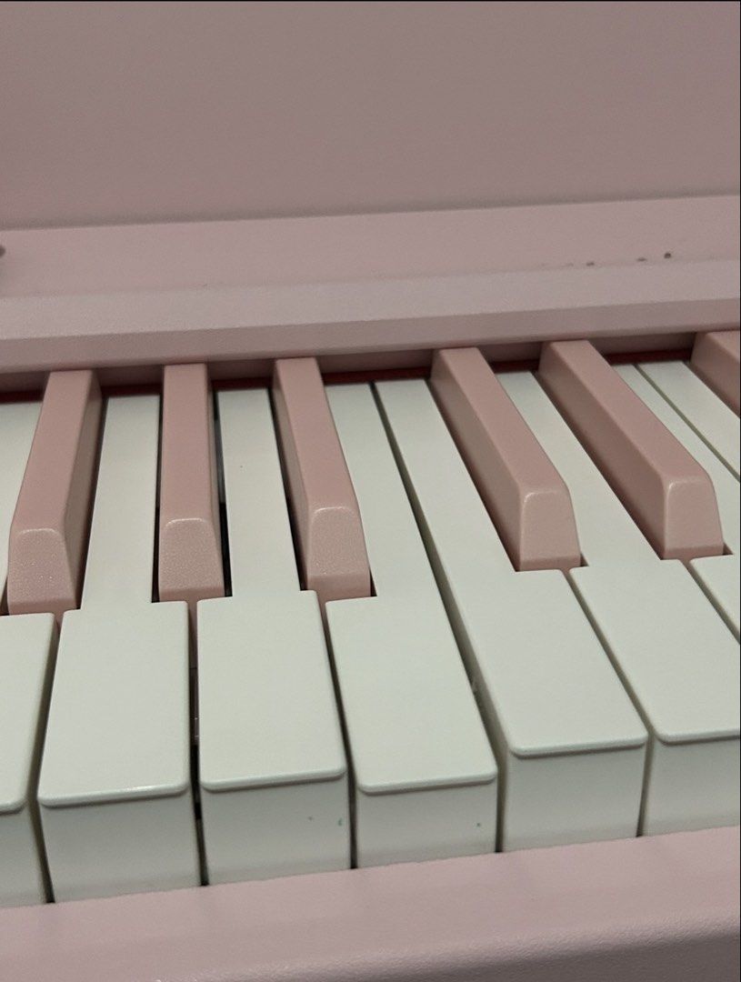 WENCAI Pink Electronic Keyboard Piano (Category: Musical Instruments) located in Manila. Submitted by donnaburde79462 (Listing ID 1469798454, Image 2). Description: - Aesthetic soft pastel pink WENCAI digital weighted keyboard - Full 88-key standard layout with alternating pink and white sharps/flats - Beginner-friendly: includes note and staff stickers applied on all keys for easy sheet music reading - Comes with a matching pink music rest stand