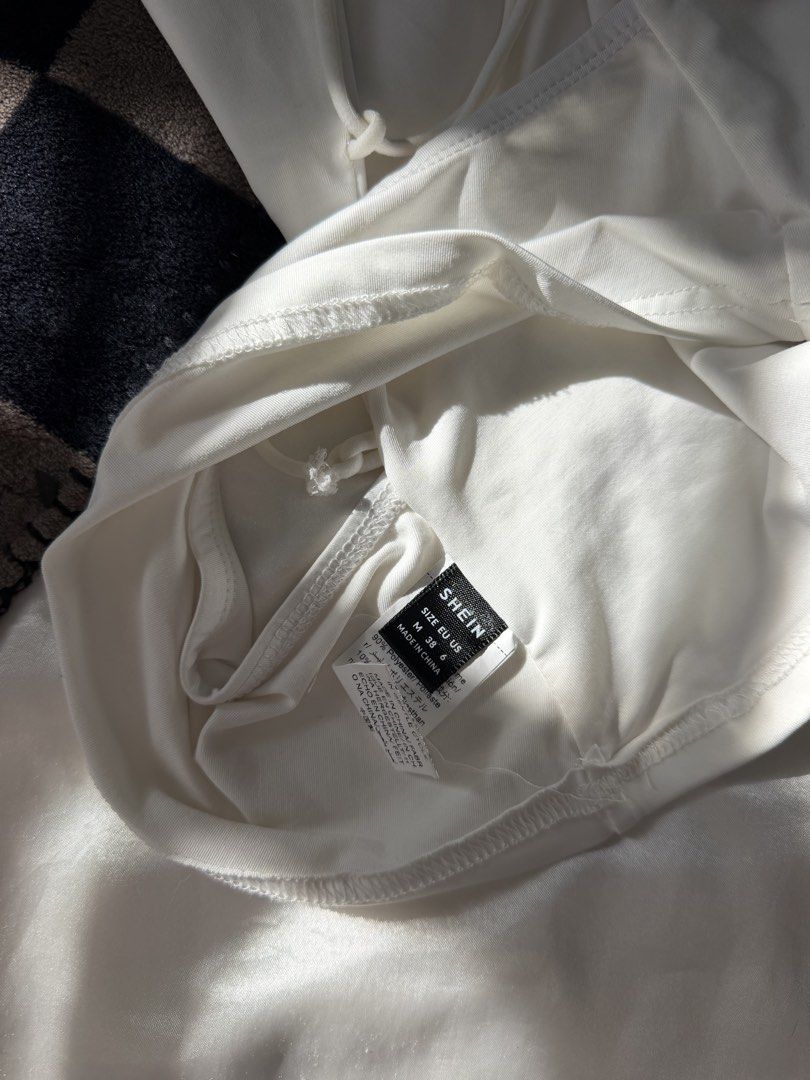 White Backless Top (SHEIN) (Category: Sleeveless) located in Bulacan. Submitted by byppishh__ (Listing ID 1469865639, Image 3). Description: SHEIN White Backless Top Size: M In good condition Double lining Sexy back Gives shape when worn! 🔖80.