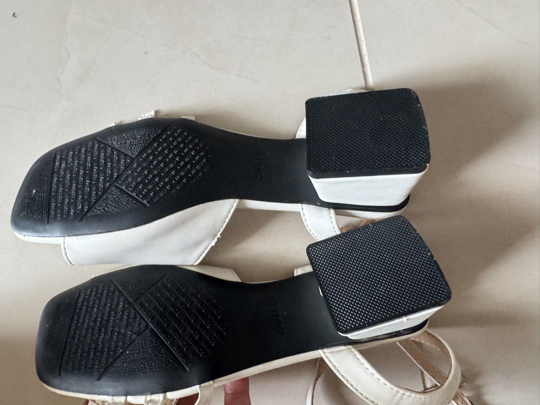White block heel sandals with ankle strap size 36 (Category: Heels) located in Quezon City. Submitted by tinylee60 (Listing ID 1469767964, Image 3). Description: White block heel sandals with buckle details on the side. Ankle strap closure. Low square heels in black and white. Never been used.