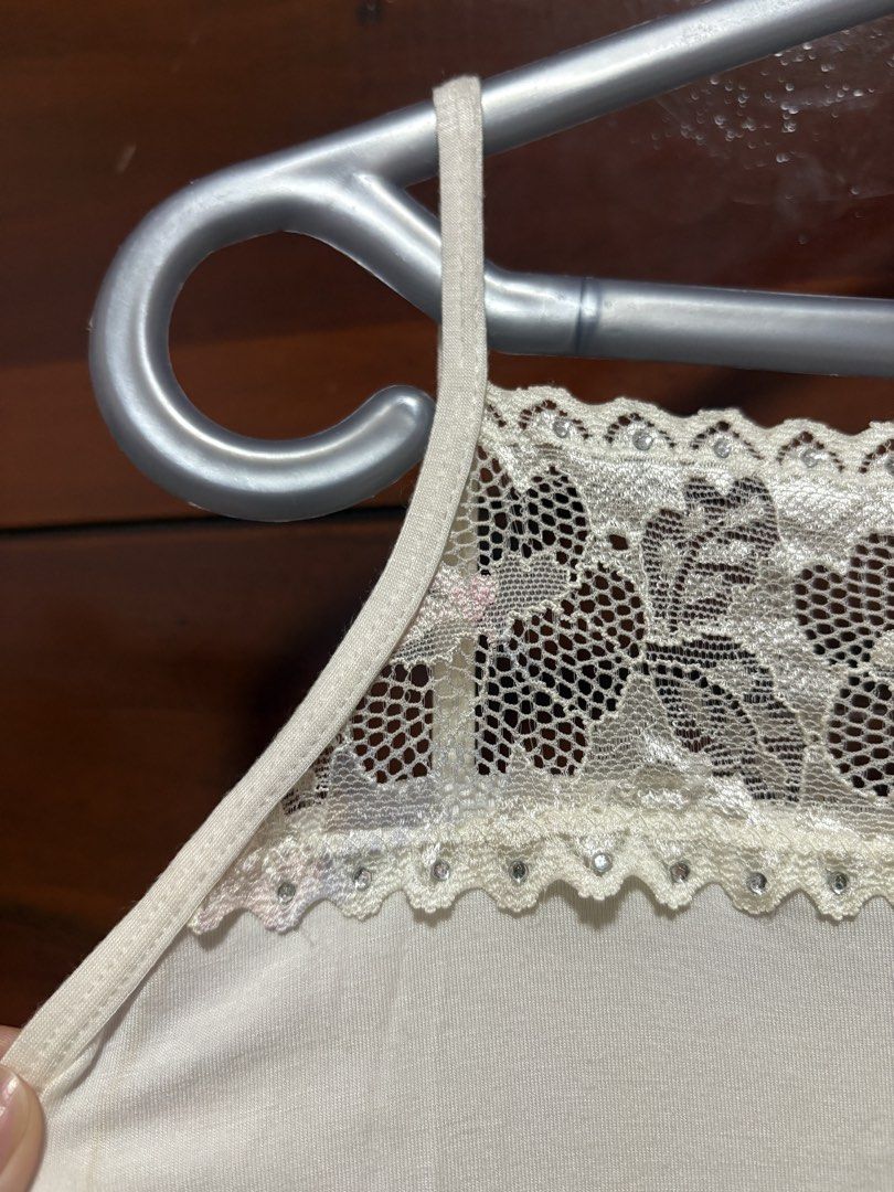 White Floral Lace Tank Top (Category: Sleeveless) located in Quezon City. Submitted by jjccly (Listing ID 1469913983, Image 3). Description: pre-loved pls manage ur expectations size xs-s flaw: small pink discoloration, missing gemstone no ww/addtl pic reqs.