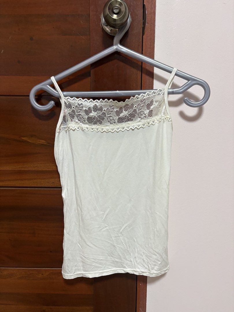 White Floral Lace Tank Top (Category: Sleeveless) located in Quezon City. Submitted by jjccly (Listing ID 1469913983, Image 1). Description: pre-loved pls manage ur expectations size xs-s flaw: small pink discoloration, missing gemstone no ww/addtl pic reqs.