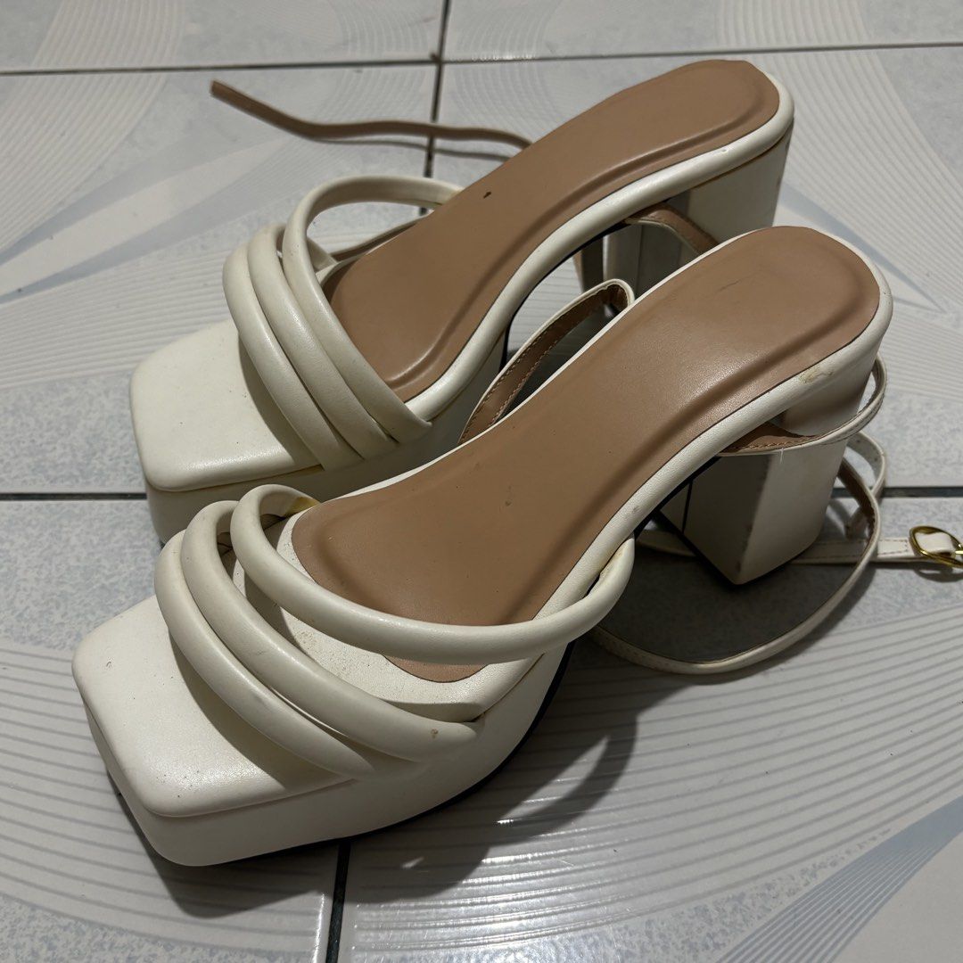 White Gladiator Platform Block Heels with Straps (Category: Heels) located in Magalang. Submitted by mvenetri (Listing ID 1469875915, Image 1). Description: White Gladiator Platform Block Heels with Straps - Was never used but has been stuck in the drawer for some time - Has small yellow stains on the block heel - Pretty much can still be used :) .