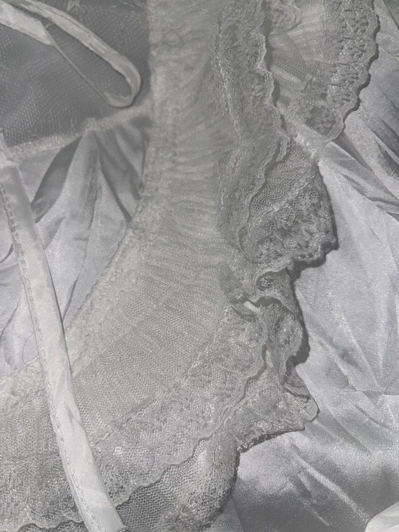 White lace trim ruffle blouse long sleeve (Category: Longsleeves) located in La Trinidad. Submitted by potatothriftlip (Listing ID 1469871120, Image 3). Description: - Style: Romantic vintage, ideal for Lolita and Gothic fashion - Design: Button-up front with a soft satin-like body fabric - Details: Sheer mesh neckline, delicate lace collar, and tiered lace cuffs - Accents: Includes a matching ribbon tie at the collar - Condition: Brand new/Mint 