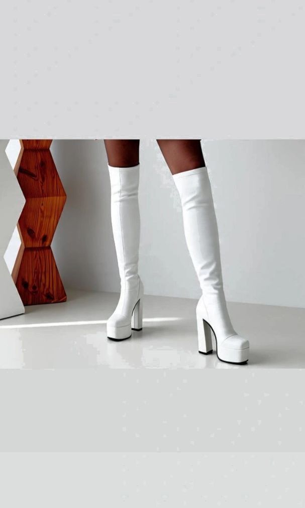 White over-the-knee chunky platform high heel boots (Category: Boots) located in Manila. Submitted by hana_0326 (Listing ID 1469824979, Image 1). Description: - Style: Over-the-knee statement boots - Color: Clean white - Finish: Smooth material - Toe Shape: Trendy square toe - Heel & Sole: High chunky heels with thick platforms - Condition: Grab them before someone else does!.