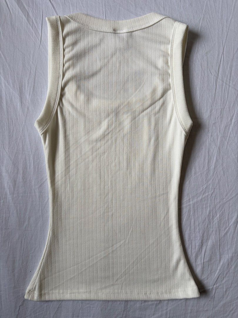 White Ribbed Square Neck Tank Top (Category: Sleeveless) located in Quezon City. Submitted by vidadmarie (Listing ID 1469825627, Image 2). Description: - Brand/Style: Mafie ribbed tank top - Color: Off-white - Size: XS-S (Tag) - Fit & Details: Snug fit, square neckline, thick straps - Never worn.