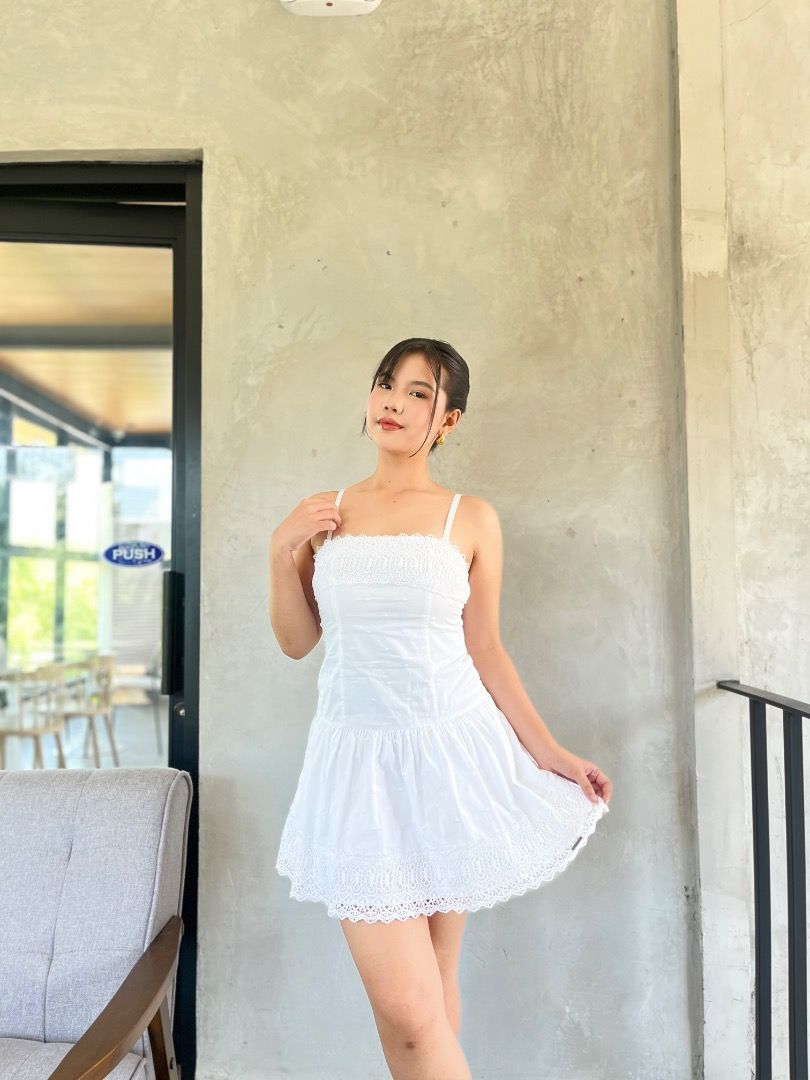 White Spaghetti Strap Mini Dress with Lace Trim (Category: Dresses) located in Caloocan City. Submitted by zaviscool (Listing ID 1469784034, Image 1). Description: - Color/Style: White mini dress with thin straps - Bodice: Smocked with cute textured details - Silhouette: Dropped waistline with a flared skirt - Details: Scallop lace trim along the bottom hem - Fabric: Lightweight, ideal for warm weather.