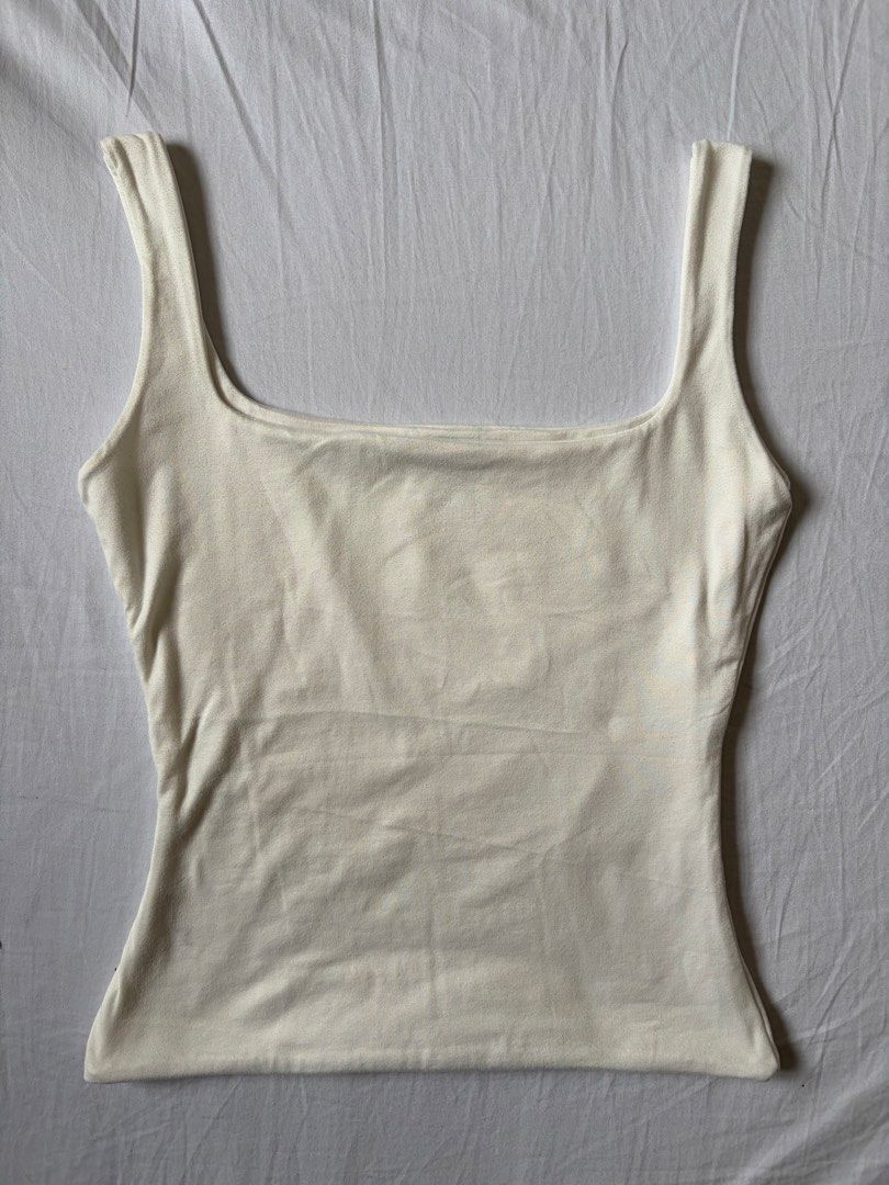 White Square Neck Tank Top (Category: Sleeveless) located in Quezon City. Submitted by vidadmarie (Listing ID 1469825652, Image 1). Description: - Brand: MERA - Style: Square neck tank top - Color: White - Size: S - Bust: 30-32” - Waist: 25-27” - Material: Bodycon.
