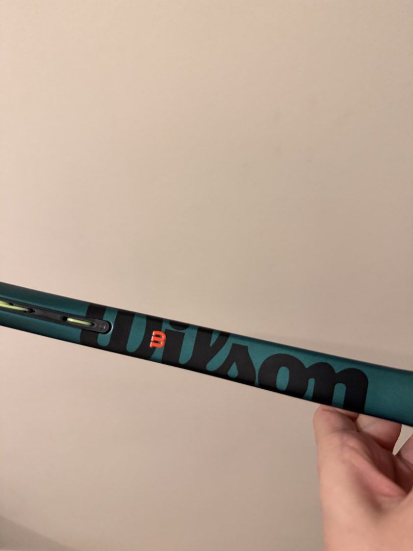 Wilson Blade 100 V9 Tennis Racket (Category: Racket and Ball Sports) located in Santa Rosa. Submitted by katcabanos (Listing ID 1469863963, Image 3). Description: - Model: Wilson Shift 100 V9 - Color: Metallic Teal - Head Size: 100 sq in - Weight: 285g - String Pattern: 16x19 -Grip 2 - Balance: 4 pts head light - Extras: Strung with lime green strings, pizza dampener included, and a fresh white overgrip wrapped on the handle - Sizing: Standard ad