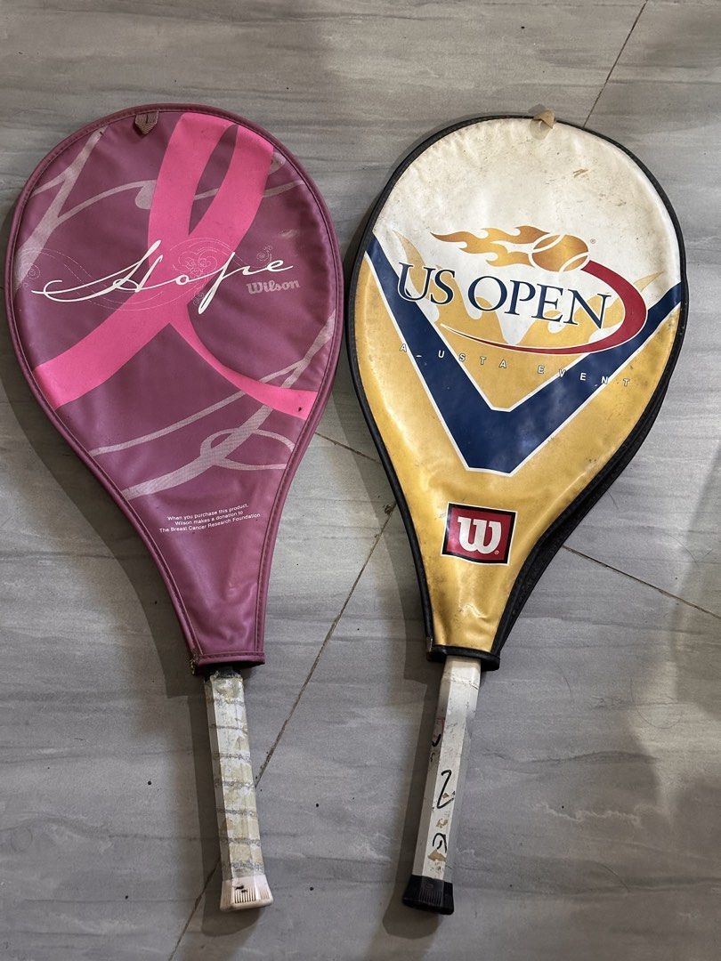 Wilson US Open and Hope Tennis Rackets Pair (Category: Racket and Ball Sports) located in Manila. Submitted by Bluebox_below (Listing ID 1469839352, Image 1). Description: - Set of 2 Wilson tennis rackets perfect for beginners and recreational players - Racket 1: White & blue US Open model, grip size 4 3/8 (L3) - Racket 2: Pink Hope edition (supports breast cancer research) - Includes original zipped covers for both rackets (other one has broken 