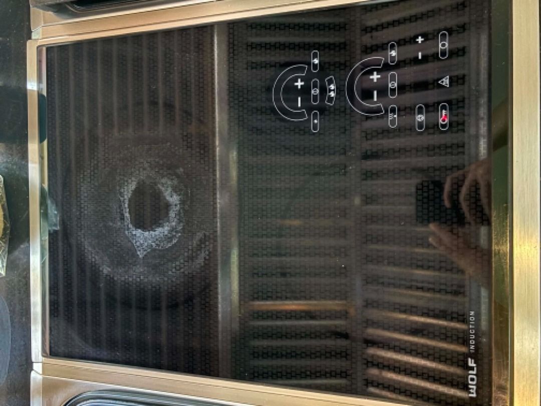Wolf Induction Cooktop and Grill Module (Category: Cookware & Accessories) located in Quezon City. Submitted by dredskie (Listing ID 1469824778, Image 2). Description: - Brand: Wolf Built-In Cooktop - Configuration: Induction zone on one side, heavy-duty grill module on the other - Controls: Touch controls integrated on glass and stainless steel surface - Condition: Removed from kitchen Reno; heavy grease buildup on cast iron grill grates; notice