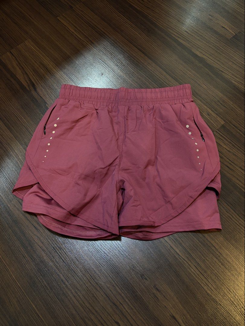 Women Athletic Running Shorts (Category: Shorts) located in Paranaque City. Submitted by trendyclothesco (Listing ID 1469847909, Image 2). Description: - Brand: TikTok Shop - Condition: Brand new with original paper tag attached - Color: dusty rose - Design: Double-layer with built-in inner shorts - Pockets: Convenient side zipper pockets with reflective dot details - Bought for P380.