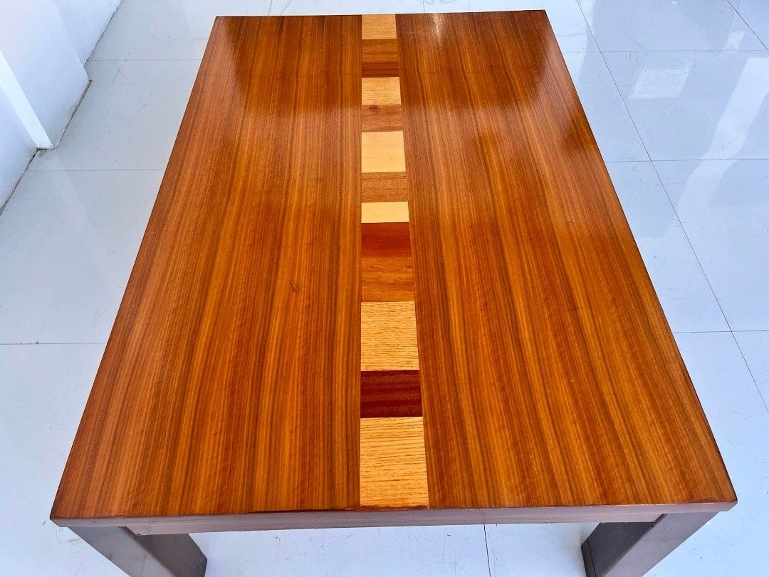 Wooden coffee table with decorative inlay stripe (Category: Tables & Sets) located in Manila. Submitted by roveeeeelen_06 (Listing ID 1469764102, Image 3). Description: - Solid wood construction with a smooth, glossy finish - Eye-catching decorative stripe made of alternating wood tones down the center - Clean rectangular shape with a sturdy four-leg design - Natural wood grain visible throughout - Versatile size, fits nicely in living rooms or l
