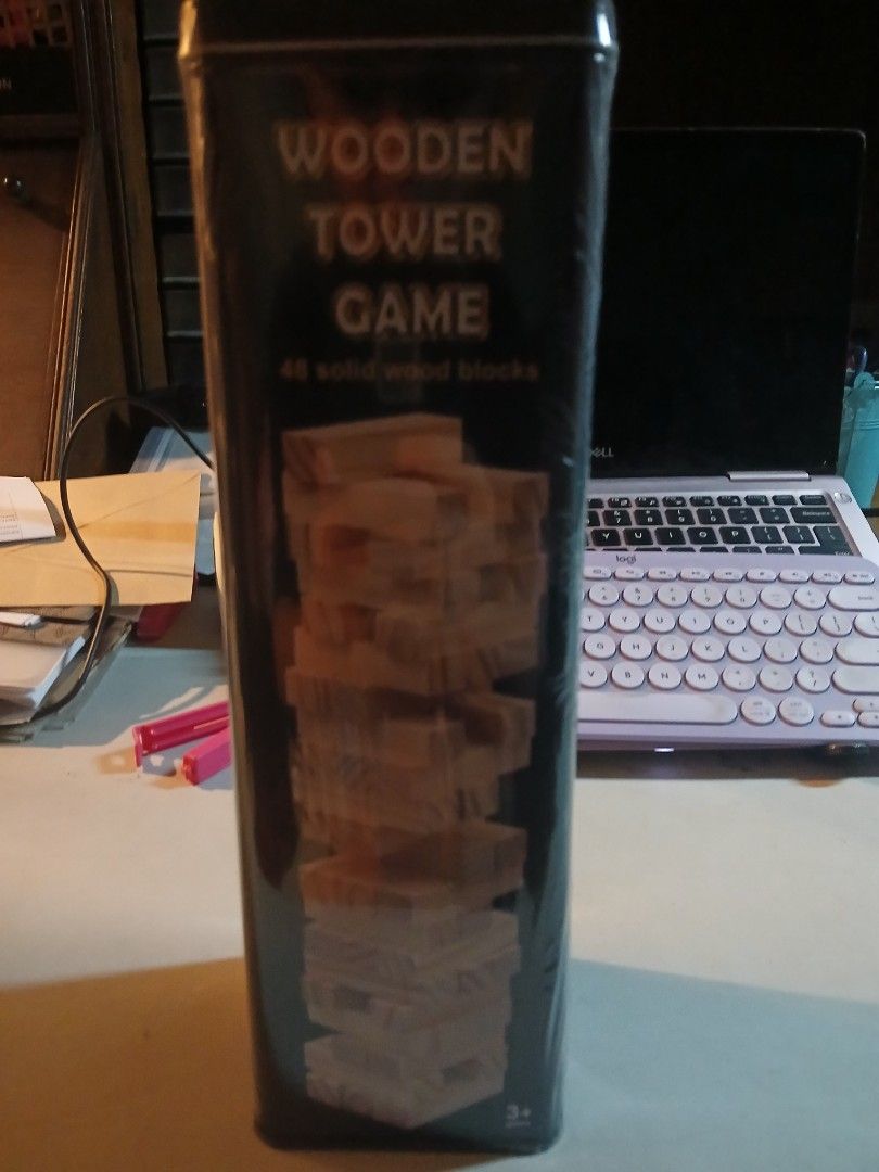 Wooden Tower Game Solid Wood Blocks (Category: Board Games & Puzzles) located in Quezon City. Submitted by lorenzomarcalain (Listing ID 1469858922, Image 1). Description: - Brand new: Still sealed in original plastic wrap - Complete set: Includes 48 solid wood blocks - Convenient storage: Comes in a durable metal tin - Fun for all: Great party game for family and friends - Easy to play: Quick setup and simple rules.