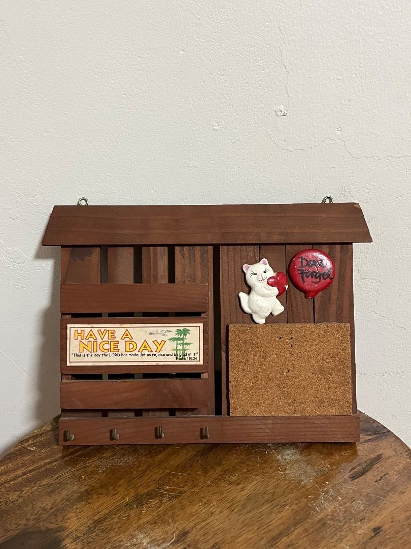 Wooden Wall Organizer Key Holder Mail Rack Corkboard (Category: Wall Decor) located in Cabuyao City. Submitted by rdtrmt (Listing ID 1469801005, Image 1). Description: - Multi-functional wooden wall organizer for your entryway - Mail slot printed with 'HAVE A NICE DAY' and an inspiring Bible verse - Built-in corkboard pinboard for notes and reminders - Cute ceramic white cat figurine holding a red heart - Red 'Don't Forget' speech bubble accent -