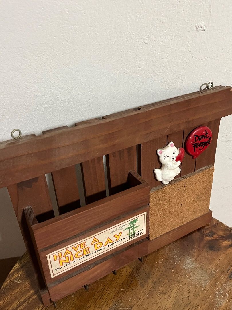 Wooden Wall Organizer Key Holder Mail Rack Corkboard (Category: Wall Decor) located in Cabuyao City. Submitted by rdtrmt (Listing ID 1469801005, Image 2). Description: - Multi-functional wooden wall organizer for your entryway - Mail slot printed with 'HAVE A NICE DAY' and an inspiring Bible verse - Built-in corkboard pinboard for notes and reminders - Cute ceramic white cat figurine holding a red heart - Red 'Don't Forget' speech bubble accent -