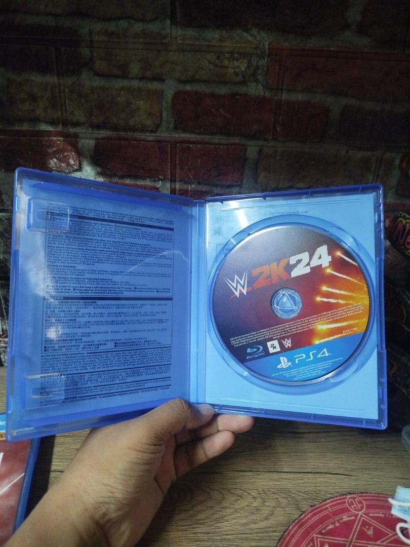 WWE 2K24 PS4 Game (Category: PlayStation) located in Binan City. Submitted by pumpkiiin02 (Listing ID 1469843355, Image 3). Description: - Game: WWE 2K24 - Platform: PlayStation 4 (PS4) - Condition: Physical disc with original case included - Region: Region-free (works on any local PS4) - Features: Solo and multiplayer modes, featuring cover star Cody Rhodes - Status: Tested and ready to play.
