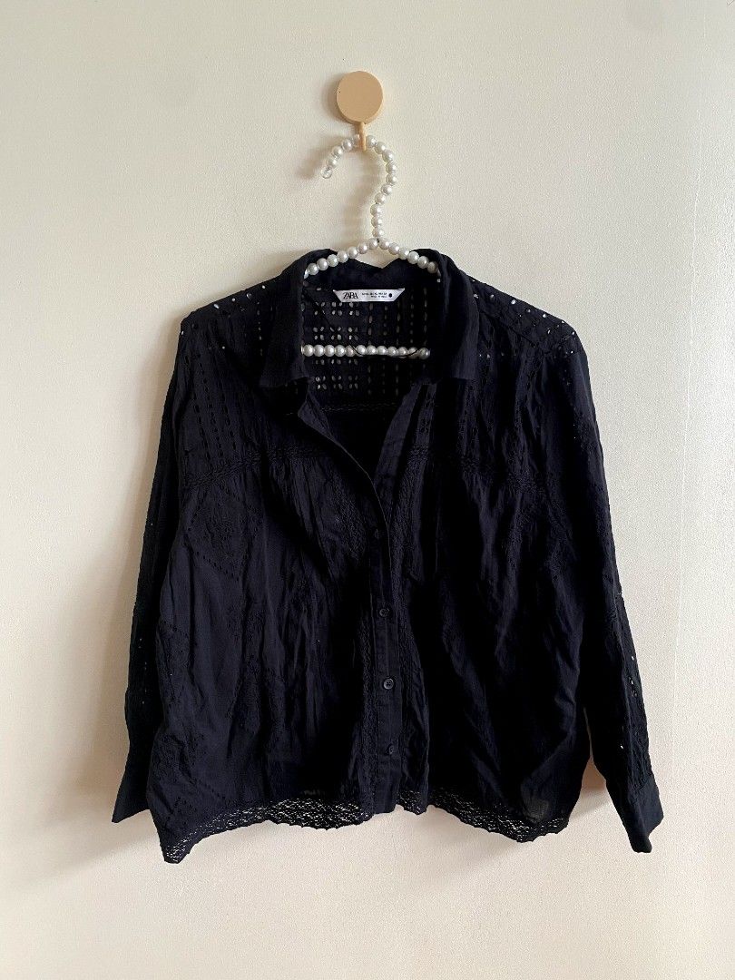 XL Zara Black Button Down Eyelet Blouse (Category: Others Tops) located in Castillejos. Submitted by lalainecloset22 (Listing ID 1469788233, Image 3). Description: - Brand: Zara - Style: Long-sleeve button-down blouse with intricate eyelet embroidery details - Color: Classic Black - Size: XL (EUR/USA/MEX) - Condition: Excellent, well-maintained - Features: Breathable fabric, button closure, elegant textured pattern throughout - Perfect for: Casua