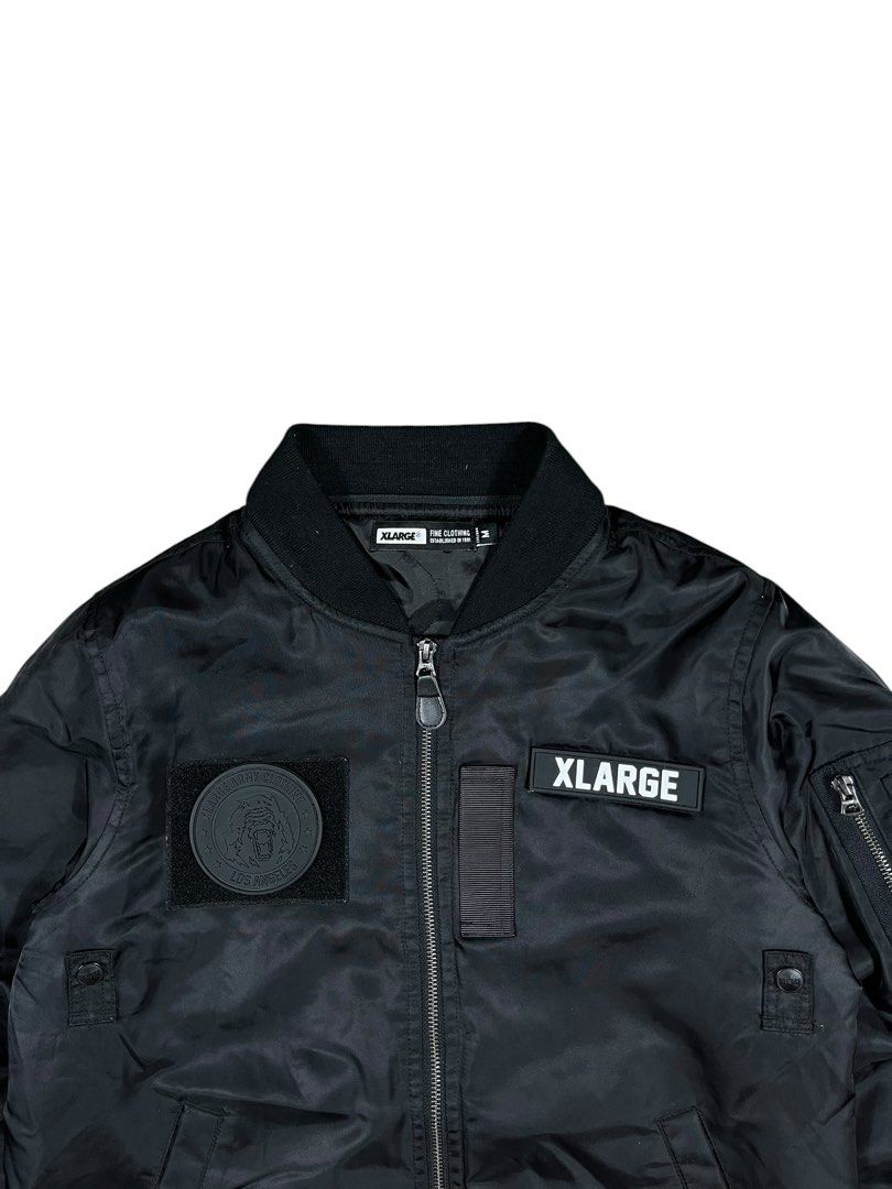 Xlarge Bomber Jacket (Category: Coats, Jackets and Outerwear) located in Bacolod City. Submitted by piquedup.ph_v2 (Listing ID 1469929185, Image 3). Description: Xlarge military-style patch bomber jacket -Authentic Size: Medium | 21x25.5 Condition: Excellent Color rate: 9.5/10 (Color may vary to lighting) Flaws: None.