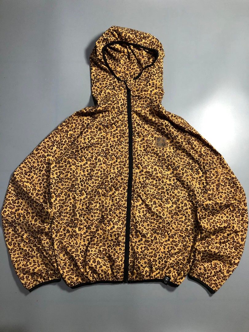 X-Large Leopard Print Zip-Up Windbreaker Jacket (Category: Coats, Jackets and Outerwear) located in Manila. Submitted by j_fnds.dvo (Listing ID 1469878240, Image 1). Description: - Style: Leopard print windbreaker - Features: Full zip front, attached hood, branded leather patch, and hem logo tag - Material: Lightweight, ideal for windy weather - Sizing: Marked Size M inside, but fits X-Large - Condition: Clean inside and out, flawless.