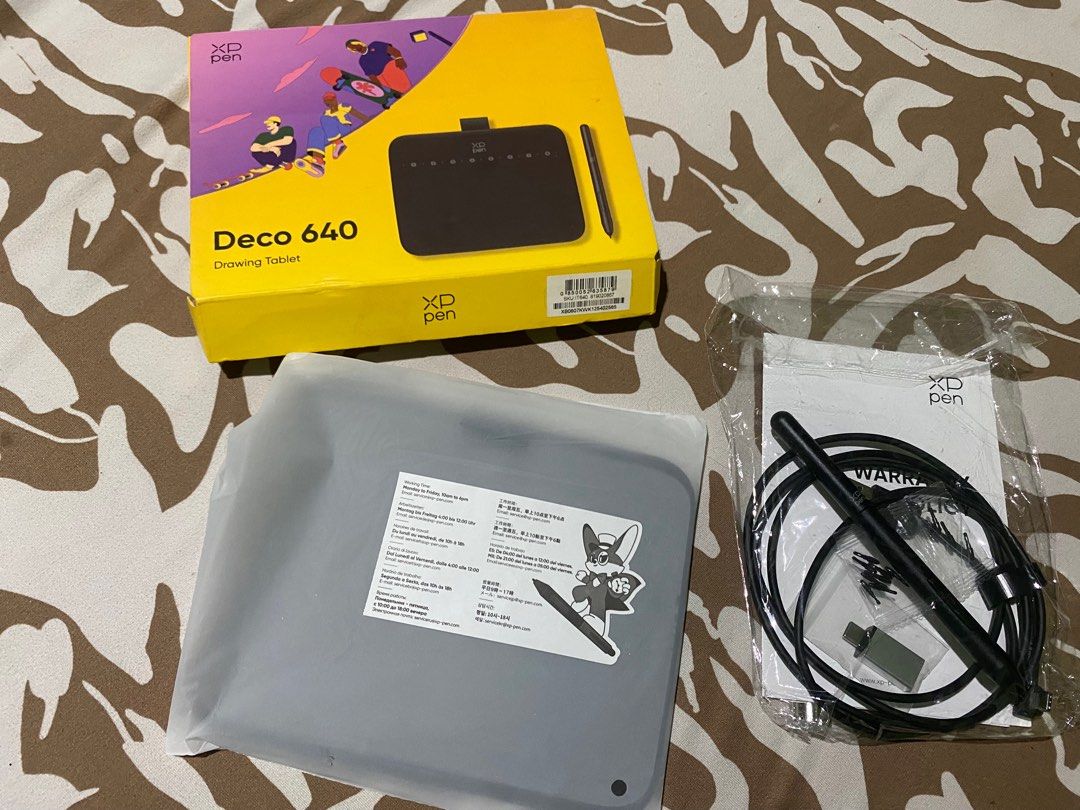 XP-Pen Deco 640 Drawing Tablet (Category: Art & Prints) located in Manila. Submitted by mightyfox-d1c300 (Listing ID 1469867110, Image 1). Description: - Brand: XP-Pen Deco 640 Drawing Tablet - Condition: Brand new, only used twice - Packaging: Original yellow box included - Tablet Status: Sealed inside original protective plastic wrapping - Included Accessories: Stylus pen, cables, USB adapter, replacement nibs, and user manual (all bagged below