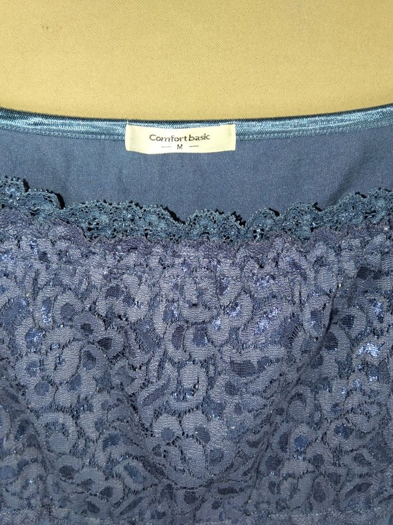 Y2k top Comfort Basic Blue Lace Camisole Size M (Category: Sleeveless) located in Bulacan. Submitted by glessantil41386 (Listing ID 1469776922, Image 2). Description: - Brand: Comfort Basic - Size: M - Color: Blue - Material: 60% polyester, 35% rayon, 5% polyurethane - Features: Floral lace chest panel, bottom lace trim, and adjustable thin shoulder straps - Condition: Great for everyday layering and comfortable wear.