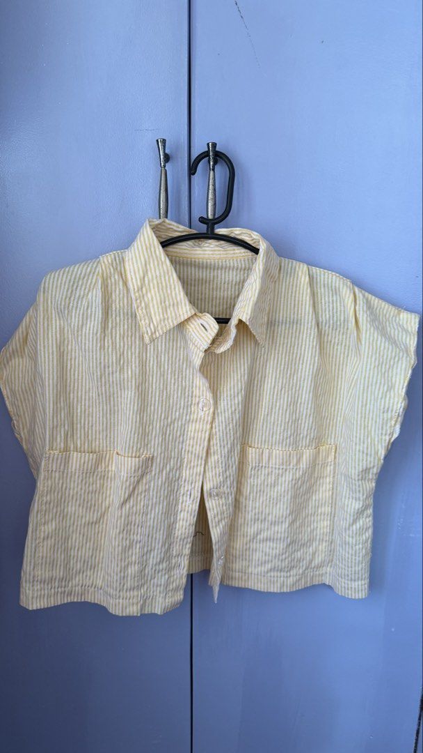 Yellow Striped Short Sleeve Cropped Button Up Shirt (Category: Blouses) located in Lipa City. Submitted by sheenamayyy (Listing ID 1469839708, Image 1). Description: Yellow & White Striped Cropped Polo 💛 Selling Price: ₱120 only! Cute and breezy striped polo from Bangkok with a relaxed, cropped silhouette. Perfect for casual days and easy to pair with high-waisted jeans, shorts, or skirts. • Brand: No brand (Bought in Bangkok) • Color: Yellow & 