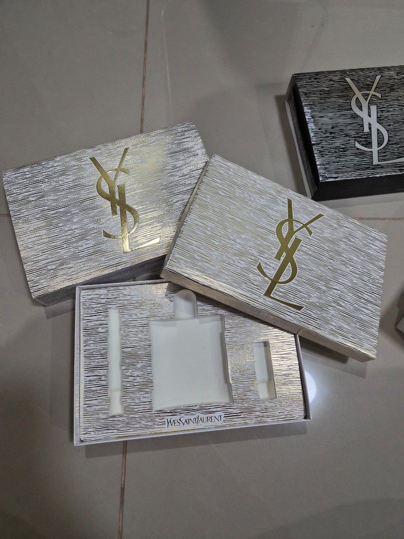 YSL Empty Gift Boxes Packaging (Category: Everything Else Others) located in Paranaque City. Submitted by lovelife.312 (Listing ID 1469797021, Image 3). Description: ***PLEASE READ CAREFULLY*** - Price stated is per piece - 1 White box - 500 php - 1 Black box - 500 php - Authentic YSL empty gift box sets (Original packaging) - Includes 2 distinct designs: White & gold textured set and Black & silver set - Comes complete with matching outer sleeve