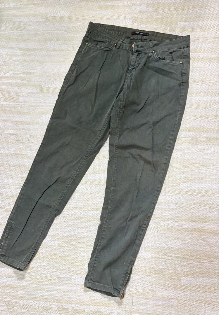 Zara Basic Olive Green Pants (Category: Jeans) located in Quezon City. Submitted by marifavo (Listing ID 1469819338, Image 1). Description: - Brand: Zara Basic - Color: Olive Green - Size: EUR 38, USA 6, MEX 28 - Origin: Made in Turkey - Design: Classic five-pocket styling with button closure and trendy zippered ankles - Fit: Comfortable and versatile everyday staple.