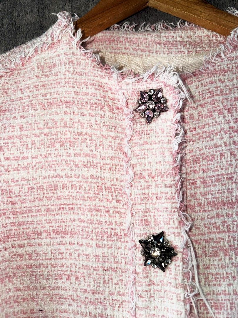 Zara Basic Pink Tweed Jacket Size S (Category: Coats, Jackets and Outerwear) located in Quezon City. Submitted by lexthrift (Listing ID 1469937700, Image 2). Description: - Brand: Zara Basic - Size: S (Made in Morocco) - Color: Pink and white tweed - Style: Short, cropped fit - Details: Distressed frayed edges along neckline, placket, pockets, and hem - Closure: Front button closure with sparkly jewel buttons - Pockets: Two front patch pockets - 