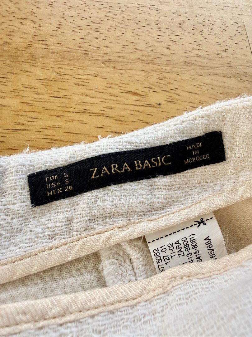 Zara Basic White Textured Raw Hem Shorts Size S (Category: Shorts) located in Agdangan. Submitted by onahhhh (Listing ID 1469774138, Image 3). Description: - Brand: Zara Basic - Color: Off-white - Size: S (EUR S, USA S, MEX 26) - Material: Textured fabric - Origin: Made in Morocco - Details: Raw frayed edges on pockets and seams, two functional back pockets - Fit: Structured fit - Condition: Great for casual warm weather days.
