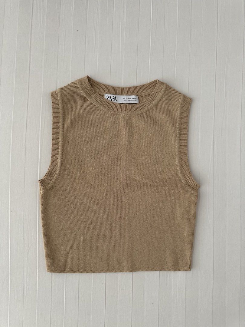 Zara Beige Knit Tank Top Size S (Category: Sleeveless) located in Manila. Submitted by denise805 (Listing ID 1469886607, Image 1). Description: - Brand: Zara - Style: Sleeveless ribbed knit tank top with crew neckline - Color: Beige - Size: S (EUR S, USA S, MEX 26) - Material: Comfortable fabric with good stretch - Condition: Clean and ready to wear - Made in: Bangladesh.