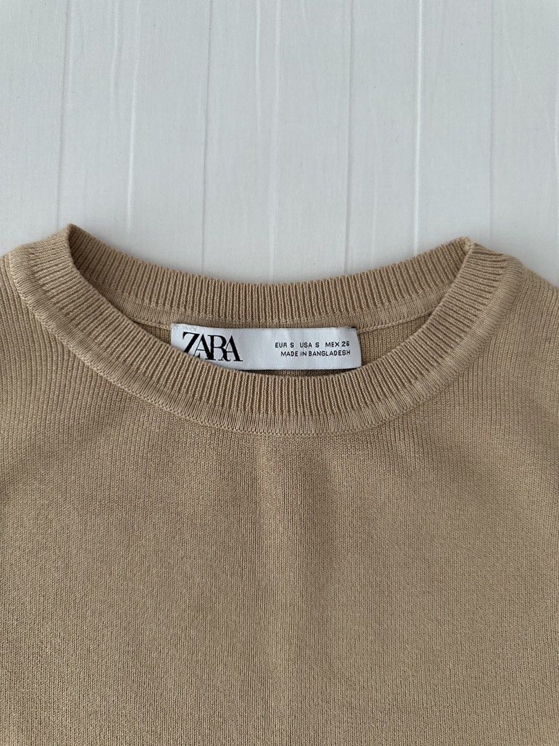 Zara Beige Knit Tank Top Size S (Category: Sleeveless) located in Manila. Submitted by denise805 (Listing ID 1469886607, Image 3). Description: - Brand: Zara - Style: Sleeveless ribbed knit tank top with crew neckline - Color: Beige - Size: S (EUR S, USA S, MEX 26) - Material: Comfortable fabric with good stretch - Condition: Clean and ready to wear - Made in: Bangladesh.