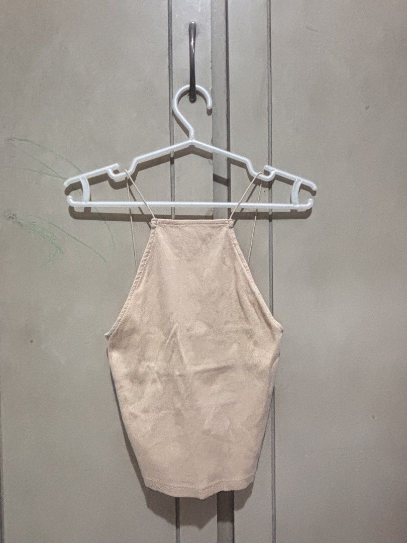 Zara Beige Spaghetti Strap Ribbed Crop Top Size S (Category: Sleeveless) located in Manila. Submitted by dragonleo_08202000 (Listing ID 1469823127, Image 2). Description: - Brand: Zara - Size: S (EUR S, USA S, MEX 26) - Color: Neutral beige - Material: Lightweight, stretchy ribbed fabric - Design: Spaghetti straps, high halter neckline, open back - Condition: Worn a few times, well-kept - Made in: Bangladesh - Perfect for layering or pairing with